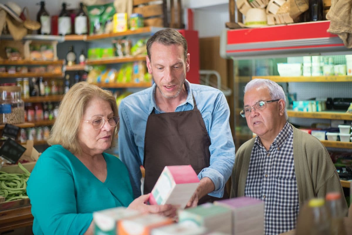 Shopkeeper assisting a customer in a store